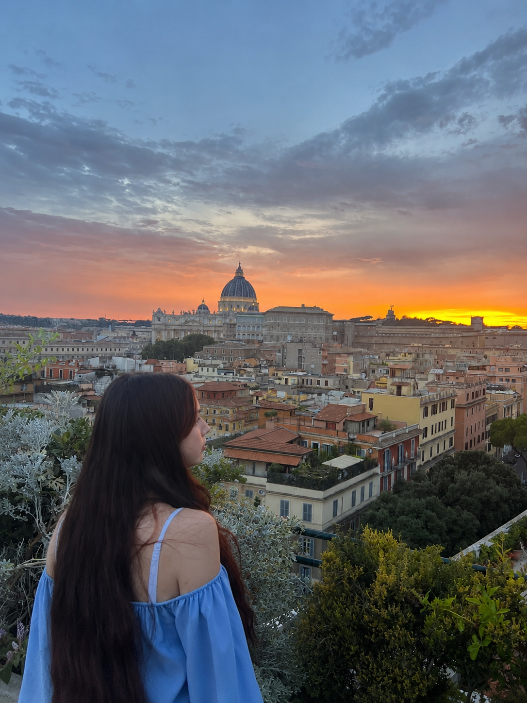 Ki, the artist behind KiCandles, looking across Rome at sunset